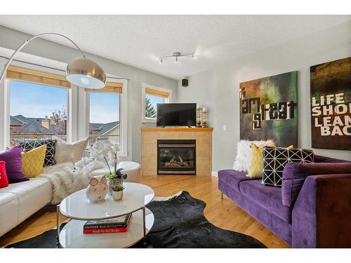 32 Patina Terrace Sw, Calgary, AB - Indoor Photo Showing Living Room With Fireplace