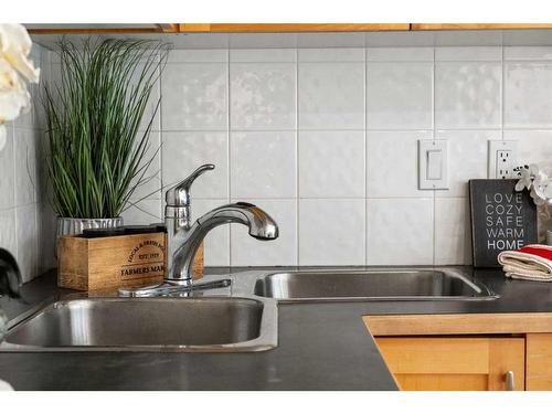 32 Patina Terrace Sw, Calgary, AB - Indoor Photo Showing Kitchen With Double Sink