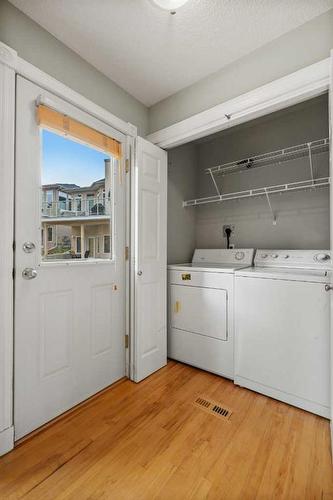 32 Patina Terrace Sw, Calgary, AB - Indoor Photo Showing Laundry Room