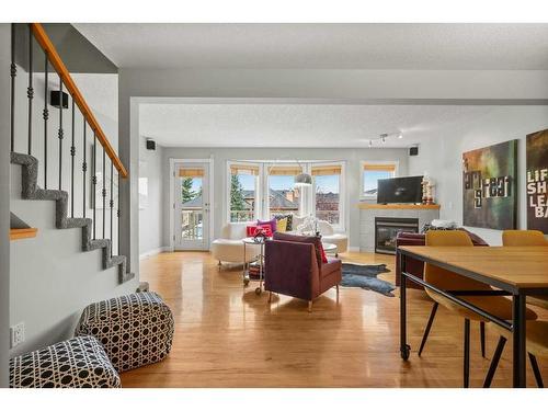 32 Patina Terrace Sw, Calgary, AB - Indoor Photo Showing Living Room With Fireplace