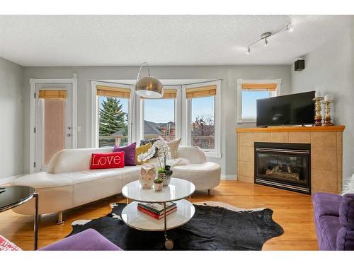 32 Patina Terrace Sw, Calgary, AB - Indoor Photo Showing Living Room With Fireplace