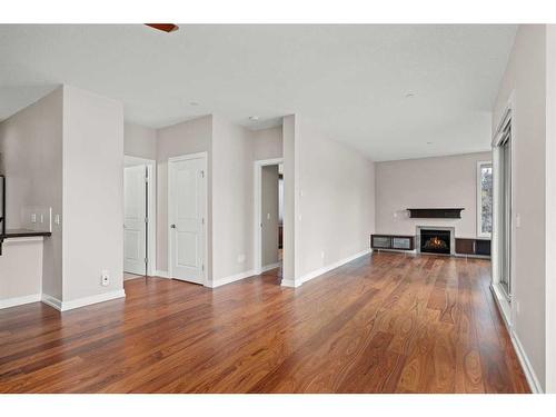 203-488 7 Avenue Ne, Calgary, AB - Indoor Photo Showing Other Room With Fireplace