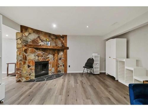 39 Strathclair Rise Sw, Calgary, AB - Indoor Photo Showing Living Room With Fireplace