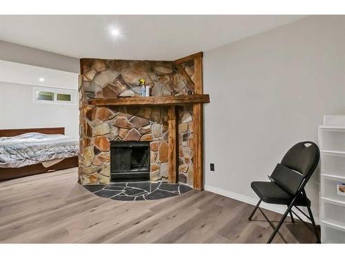 39 Strathclair Rise Sw, Calgary, AB - Indoor Photo Showing Other Room With Fireplace