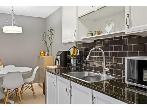 330-820 89 Avenue Sw, Calgary, AB - Indoor Photo Showing Kitchen With Double Sink