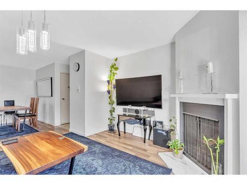 9101-315, Southampton Drive Sw, Calgary, AB - Indoor Photo Showing Living Room With Fireplace