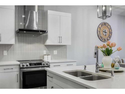 70 Seton Road Se, Calgary, AB - Indoor Photo Showing Kitchen With Double Sink