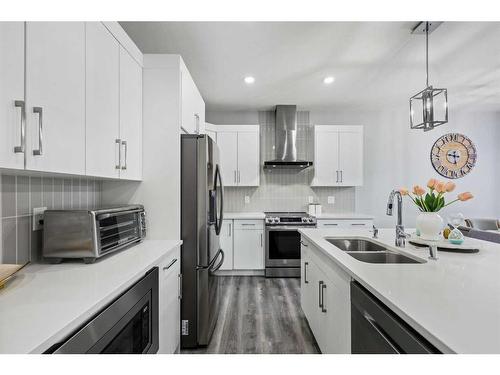 70 Seton Road Se, Calgary, AB - Indoor Photo Showing Kitchen With Stainless Steel Kitchen With Double Sink With Upgraded Kitchen