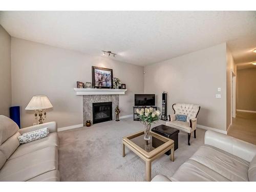 82 Sherwood Road Nw, Calgary, AB - Indoor Photo Showing Living Room With Fireplace