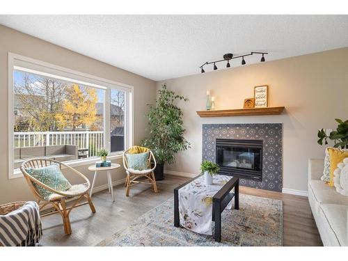 71 Tipping Close Se, Airdrie, AB - Indoor Photo Showing Living Room With Fireplace