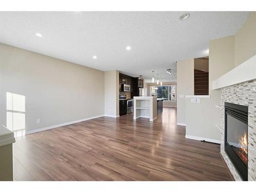 176 Auburn Meadows Boulevard Se, Calgary, AB - Indoor Photo Showing Living Room With Fireplace