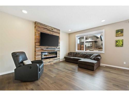 618 Kingsmere Way Se, Airdrie, AB - Indoor Photo Showing Living Room With Fireplace