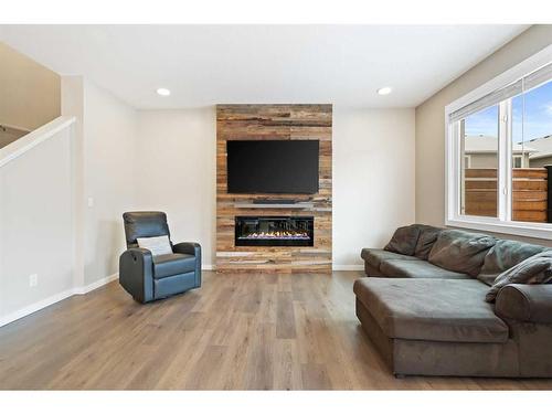 618 Kingsmere Way Se, Airdrie, AB - Indoor Photo Showing Living Room With Fireplace