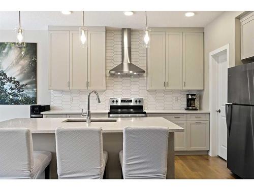 618 Kingsmere Way Se, Airdrie, AB - Indoor Photo Showing Kitchen With Stainless Steel Kitchen With Upgraded Kitchen