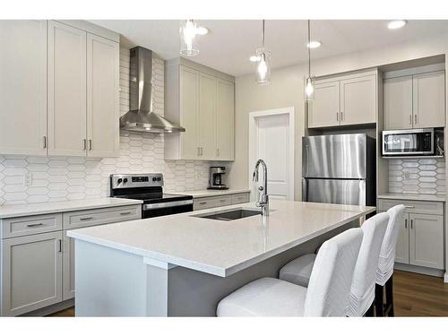 618 Kingsmere Way Se, Airdrie, AB - Indoor Photo Showing Kitchen With Stainless Steel Kitchen With Upgraded Kitchen