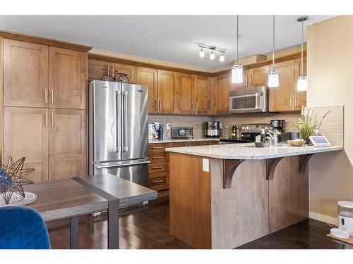 1310-450 Sage Valley Drive Nw, Calgary, AB - Indoor Photo Showing Kitchen With Stainless Steel Kitchen With Upgraded Kitchen