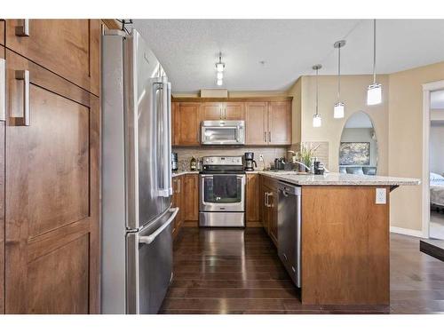 1310-450 Sage Valley Drive Nw, Calgary, AB - Indoor Photo Showing Kitchen With Stainless Steel Kitchen With Upgraded Kitchen