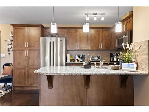 1310-450 Sage Valley Drive Nw, Calgary, AB - Indoor Photo Showing Kitchen With Stainless Steel Kitchen With Upgraded Kitchen