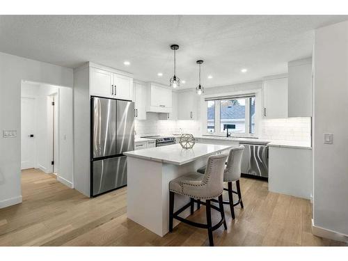 103 Woodpark Place Sw, Calgary, AB - Indoor Photo Showing Kitchen With Stainless Steel Kitchen With Upgraded Kitchen