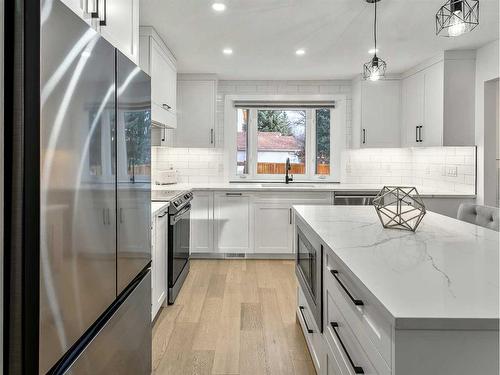 103 Woodpark Place Sw, Calgary, AB - Indoor Photo Showing Kitchen With Stainless Steel Kitchen With Upgraded Kitchen