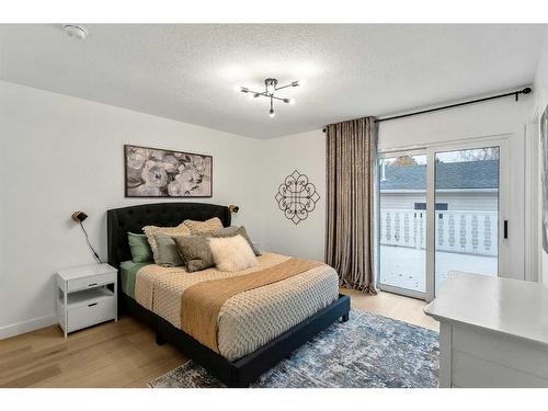 103 Woodpark Place Sw, Calgary, AB - Indoor Photo Showing Bedroom