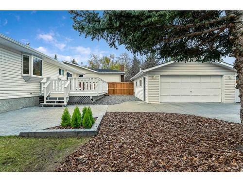 103 Woodpark Place Sw, Calgary, AB - Outdoor With Deck Patio Veranda With Exterior