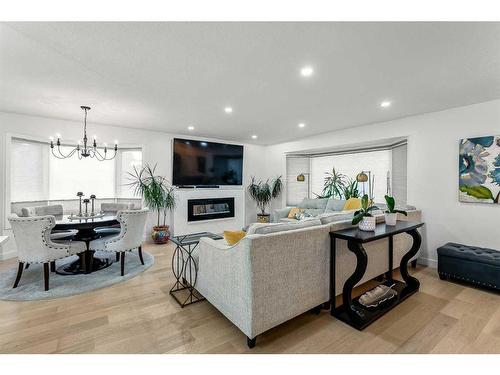 103 Woodpark Place Sw, Calgary, AB - Indoor Photo Showing Living Room With Fireplace