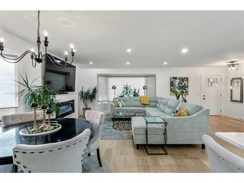 103 Woodpark Place Sw, Calgary, AB - Indoor Photo Showing Living Room With Fireplace