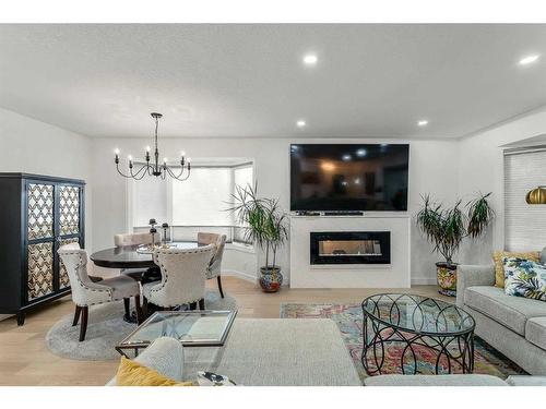 103 Woodpark Place Sw, Calgary, AB - Indoor With Fireplace