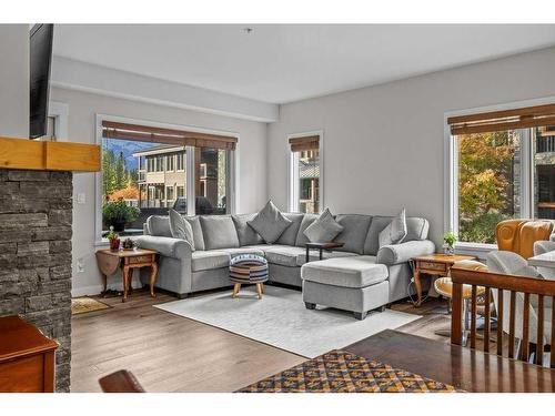 109-707 Spring Creek Drive, Canmore, AB - Indoor Photo Showing Living Room With Fireplace