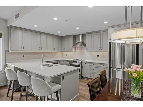 109-707 Spring Creek Drive, Canmore, AB - Indoor Photo Showing Kitchen With Double Sink With Upgraded Kitchen