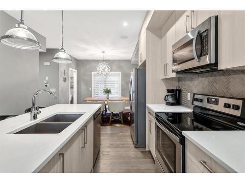 1934 26A Street Sw, Calgary, AB - Indoor Photo Showing Kitchen With Stainless Steel Kitchen With Double Sink With Upgraded Kitchen