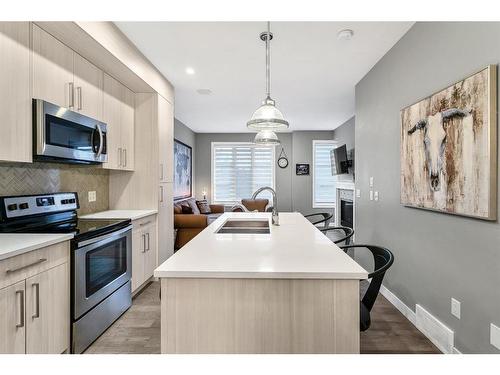 1934 26A Street Sw, Calgary, AB - Indoor Photo Showing Kitchen With Stainless Steel Kitchen With Double Sink With Upgraded Kitchen