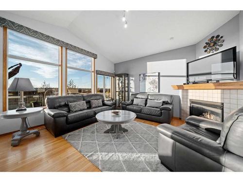 113 Pantego Road Nw, Calgary, AB - Indoor Photo Showing Living Room With Fireplace