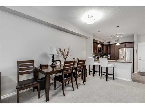 3107-4 Kingsland Close Se, Airdrie, AB - Indoor Photo Showing Dining Room