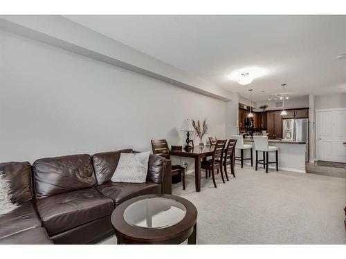 3107-4 Kingsland Close Se, Airdrie, AB - Indoor Photo Showing Living Room