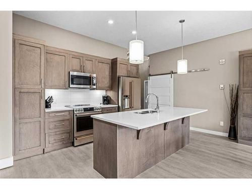 115-106 Stewart Creek Rise, Canmore, AB - Indoor Photo Showing Kitchen With Upgraded Kitchen