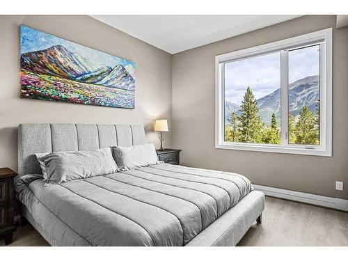 115-106 Stewart Creek Rise, Canmore, AB - Indoor Photo Showing Bedroom