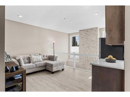 115-106 Stewart Creek Rise, Canmore, AB - Indoor Photo Showing Living Room