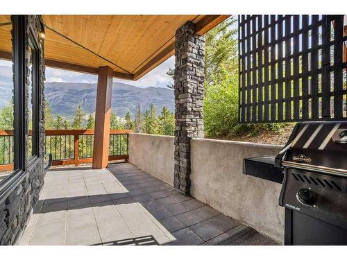 115-106 Stewart Creek Rise, Canmore, AB - Outdoor With Deck Patio Veranda With Exterior