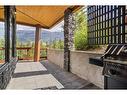 115-106 Stewart Creek Rise, Canmore, AB  - Outdoor With Deck Patio Veranda With Exterior 