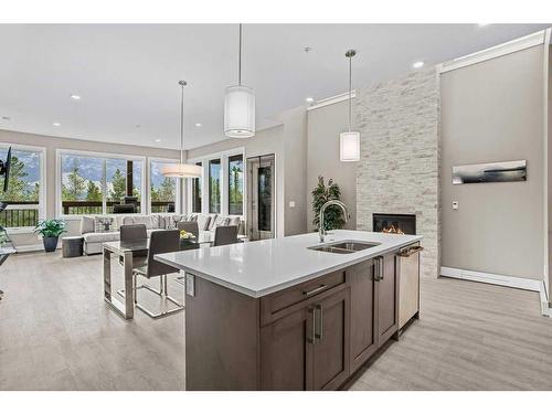 115-106 Stewart Creek Rise, Canmore, AB - Indoor Photo Showing Kitchen With Double Sink With Upgraded Kitchen