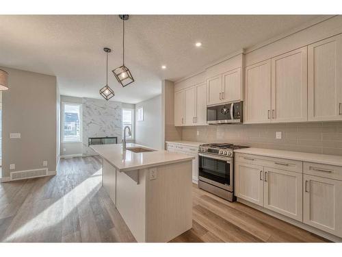 151 Amblefield Avenue Nw, Calgary, AB - Indoor Photo Showing Kitchen With Upgraded Kitchen