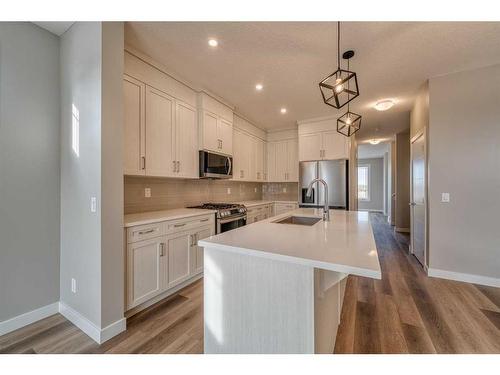 151 Amblefield Avenue Nw, Calgary, AB - Indoor Photo Showing Kitchen With Upgraded Kitchen