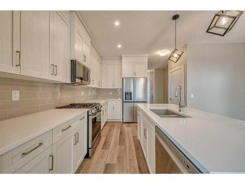 151 Amblefield Avenue Nw, Calgary, AB - Indoor Photo Showing Kitchen With Double Sink With Upgraded Kitchen