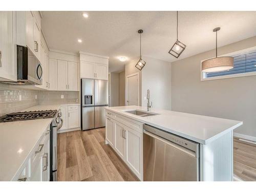 151 Amblefield Avenue Nw, Calgary, AB - Indoor Photo Showing Kitchen With Double Sink With Upgraded Kitchen