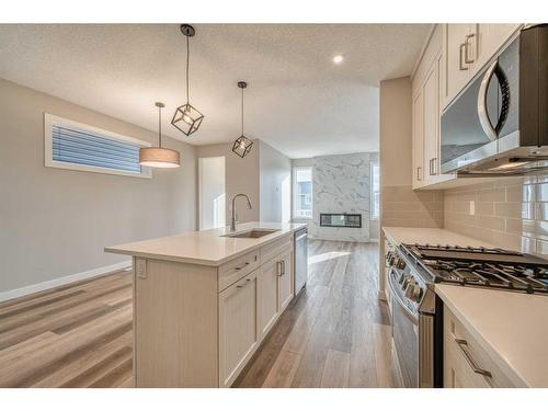 151 Amblefield Avenue Nw, Calgary, AB - Indoor Photo Showing Kitchen With Upgraded Kitchen