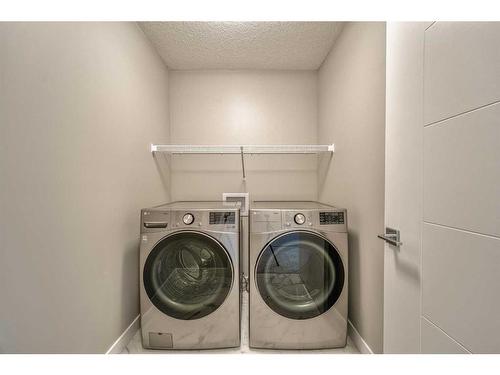 151 Amblefield Avenue Nw, Calgary, AB - Indoor Photo Showing Laundry Room