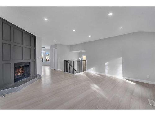 5824 Temple Drive Ne, Calgary, AB - Indoor Photo Showing Living Room With Fireplace