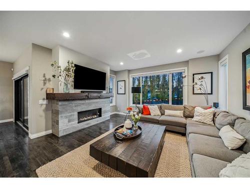 315 Simcrest Heights Sw, Calgary, AB - Indoor Photo Showing Living Room With Fireplace